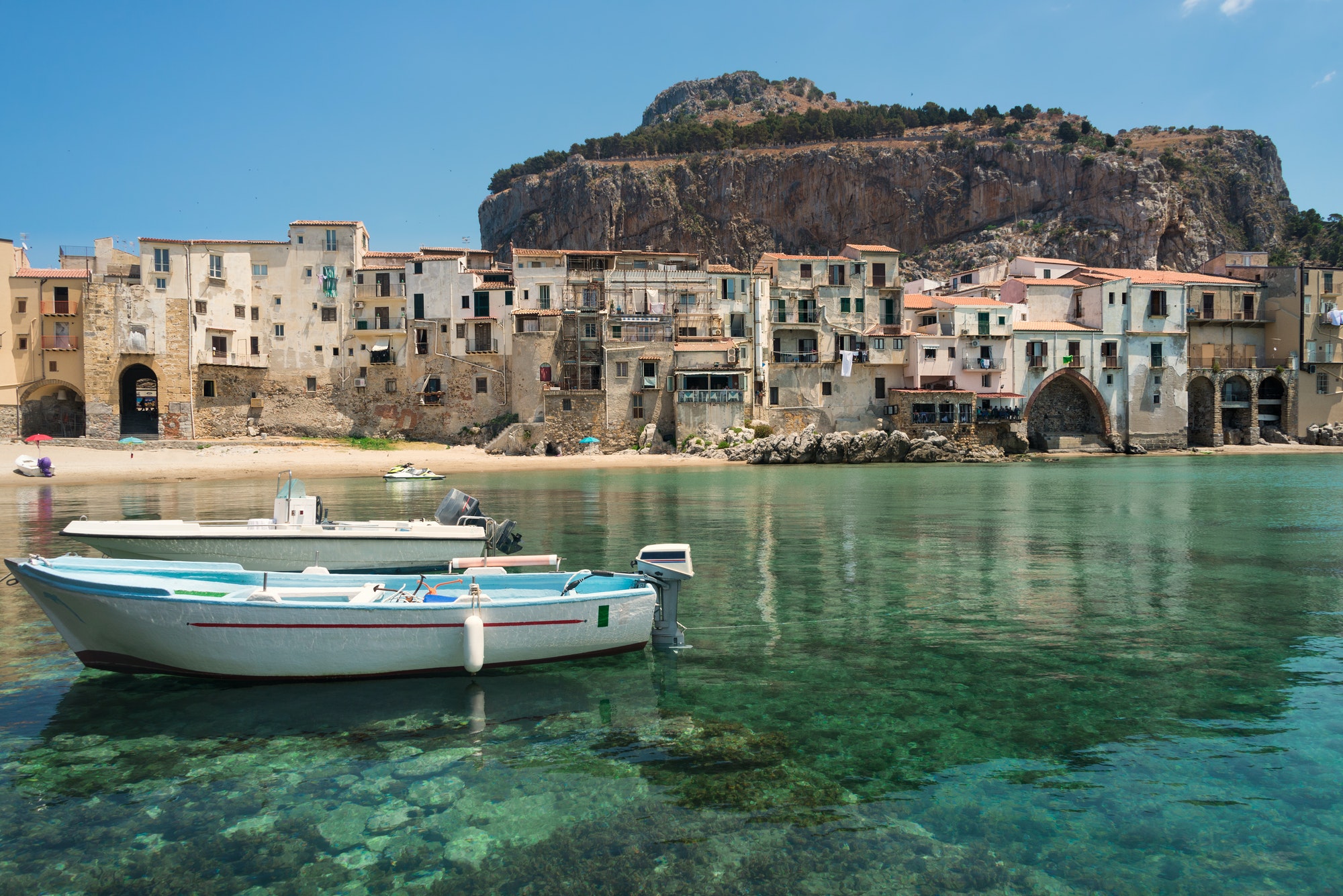 Boats and clear water in Cefalu town